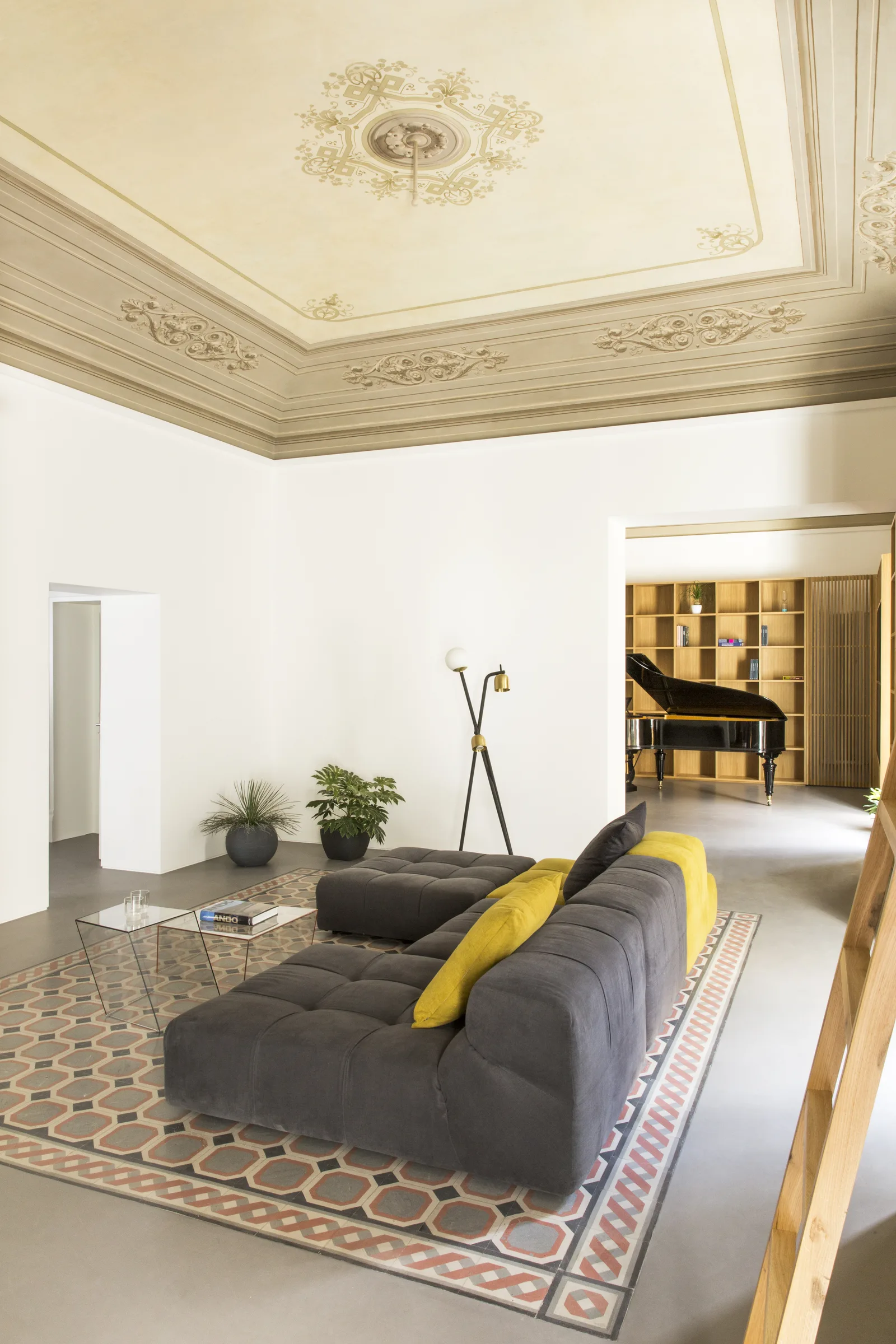 Modular sofa and floor lamp in front of the piano room